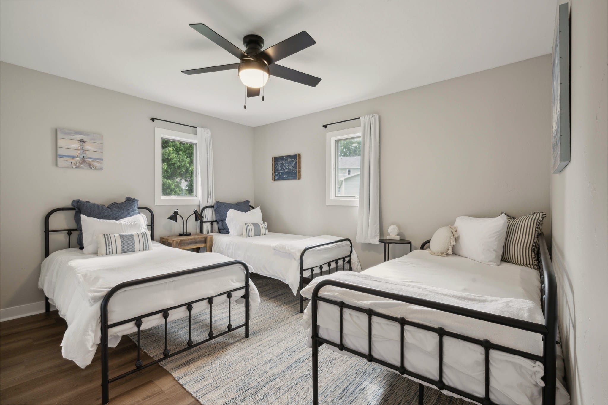 Bedroom 2 at Serenity on Strauss with twin metal beds.