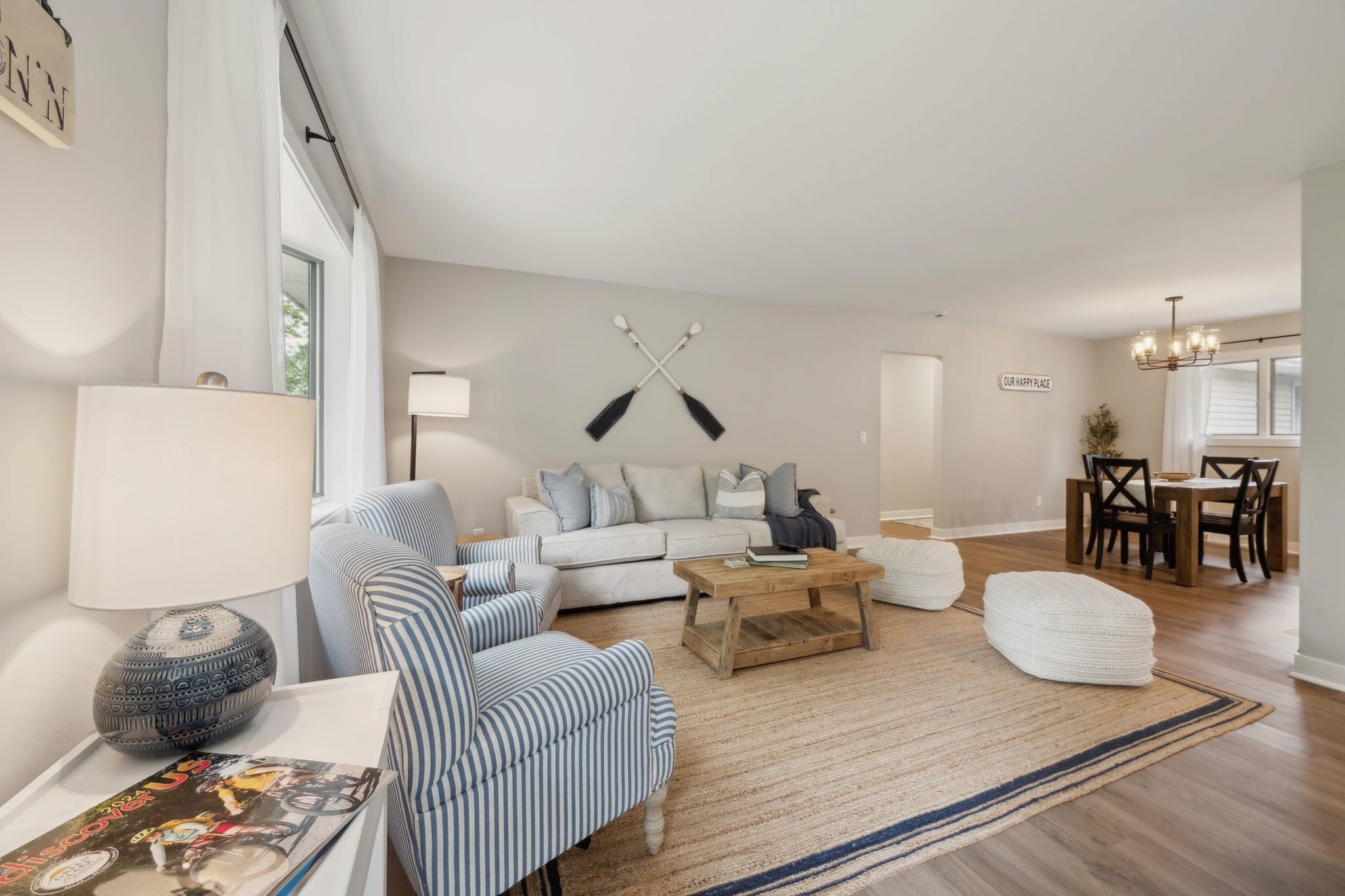 Serenity on Strauss living room with crossed-oar decor and the dining area beyond.